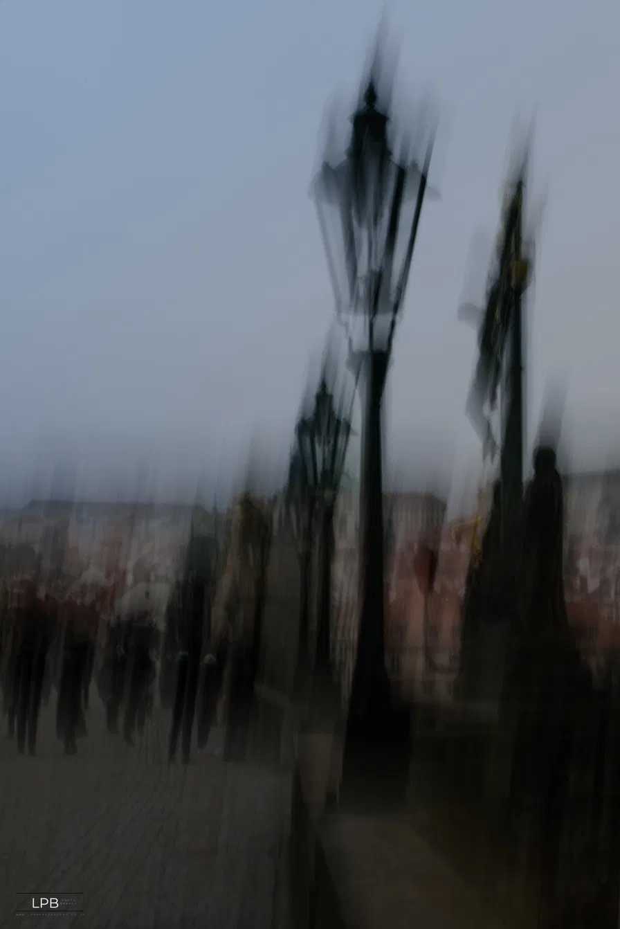 Streetlamp and statue drawn into vertical lines